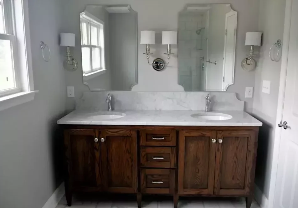 clean-bright-bathroom-with-dark-wood-vanity-and-wh-2022-11-14-03-46-11-utc-e1671747371971_a8c38b